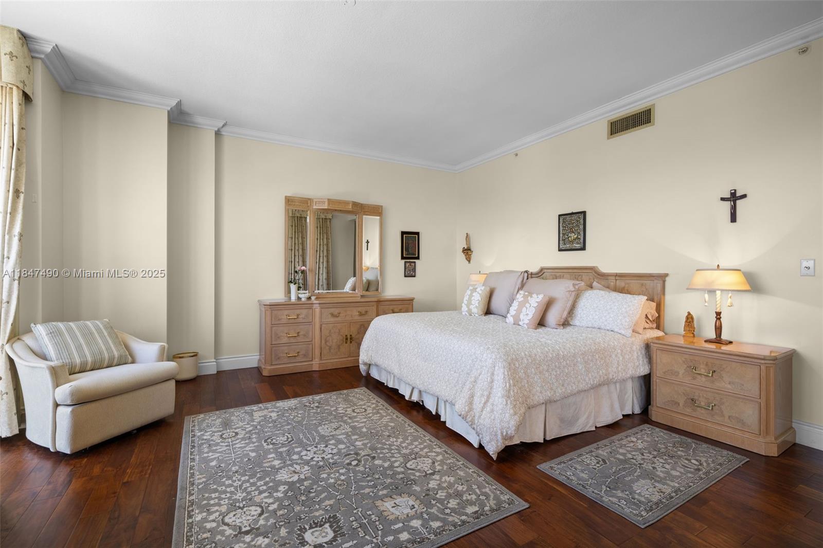 733 Crandon Boulevard, Unit 405 Key Biscayne, FL 33149 - Photo 17 of 42 a bedroom with a bed and a couch