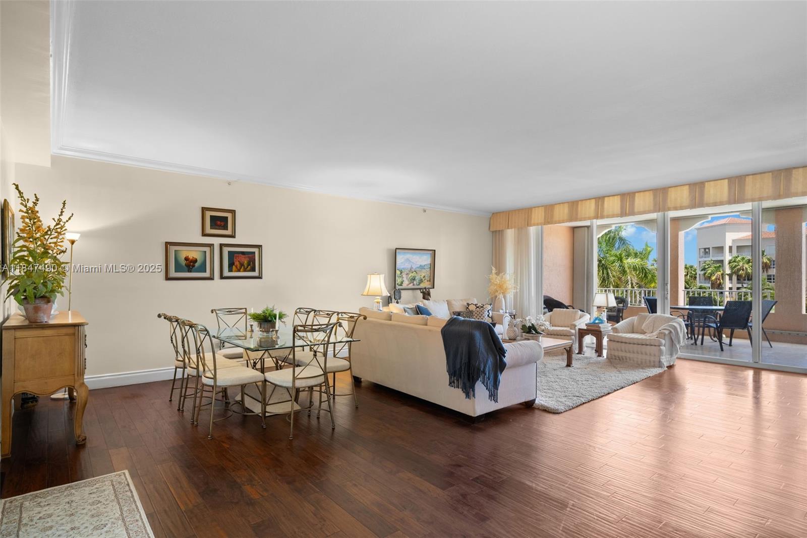 733 Crandon Boulevard, Unit 405 Key Biscayne, FL 33149 - Photo 3 of 42 a living room with furniture and a large window