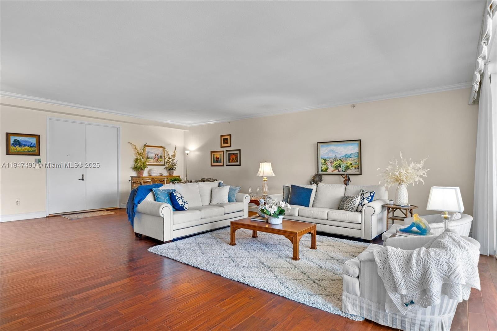 733 Crandon Boulevard, Unit 405 Key Biscayne, FL 33149 - Photo 4 of 42 a living room with furniture and wooden floor