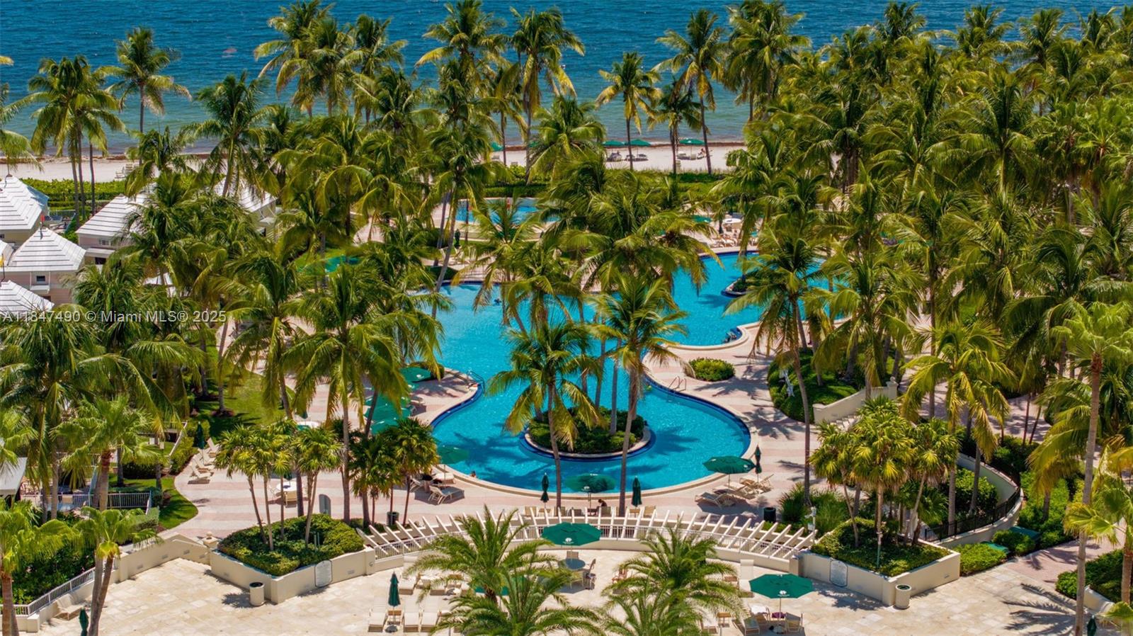 733 Crandon Boulevard, Unit 405 Key Biscayne, FL 33149 - Photo 41 of 42 a vase of flowers sitting on a table