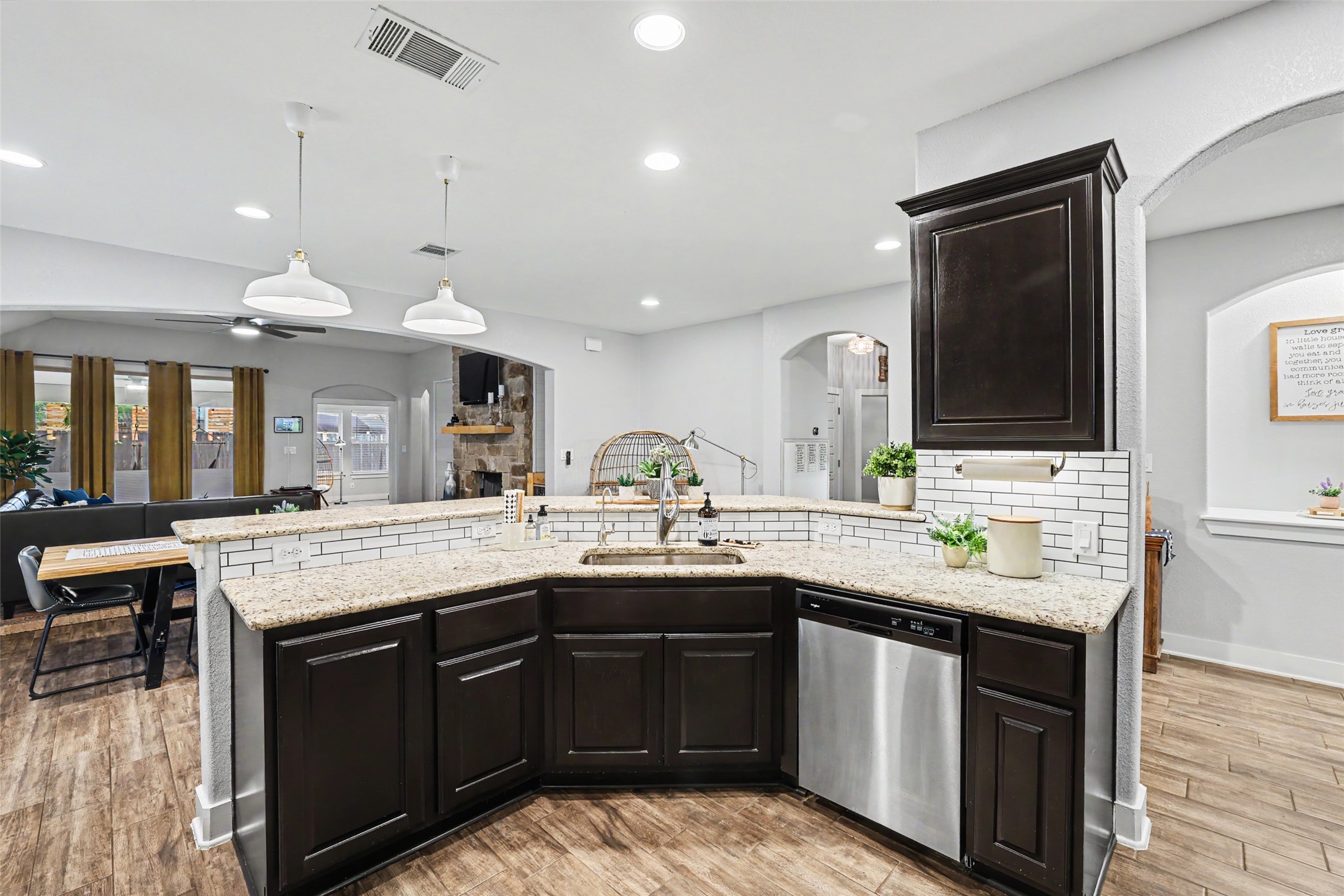 117 Rock Dock Road Georgetown, TX 78633 - Photo 15 of 38 a kitchen with a sink and a stove top oven with wooden floor