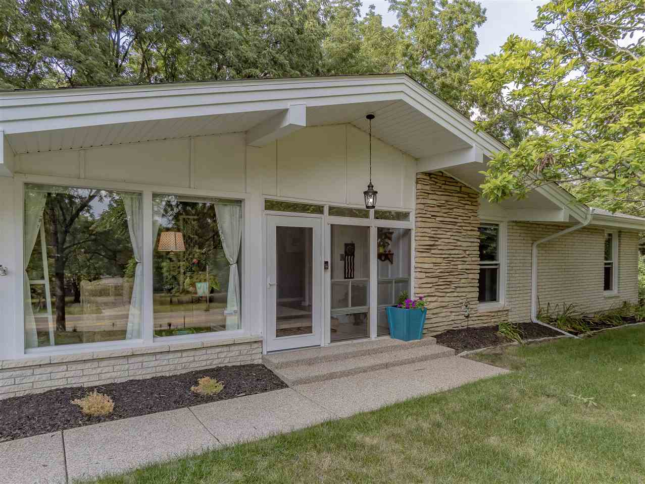 3208 Spring Creek Road Rockford, IL 61107 - Photo 1 of 45 a front view of a house with a yard and garage