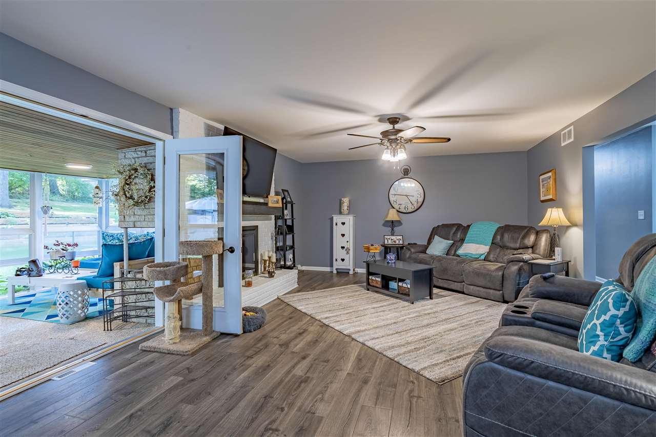 3208 Spring Creek Road Rockford, IL 61107 - Photo 14 of 45 a living room with furniture and wooden floor