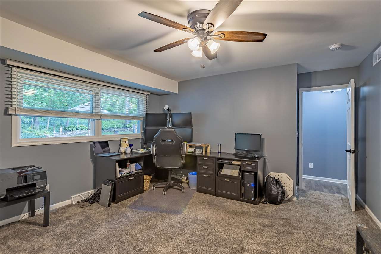3208 Spring Creek Road Rockford, IL 61107 - Photo 19 of 45 a view of a workspace with furniture and a window