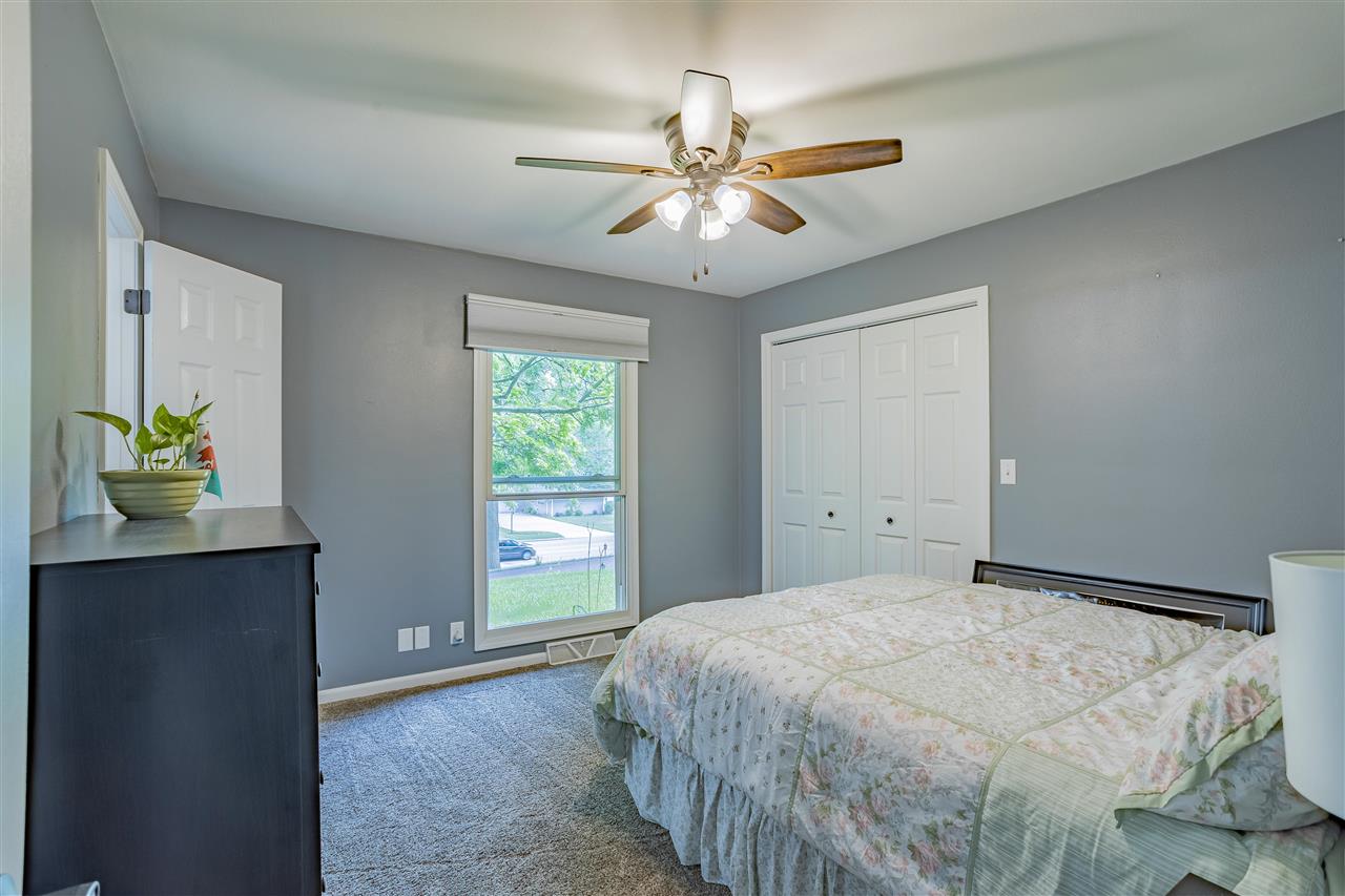 3208 Spring Creek Road Rockford, IL 61107 - Photo 21 of 45 a bedroom with a bed and a window