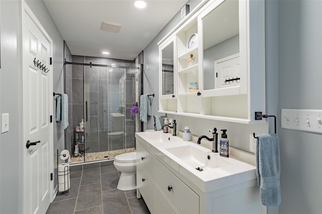 3208 Spring Creek Road Rockford, IL 61107 - Photo 26 of 45 a bathroom with a sink toilet and shower