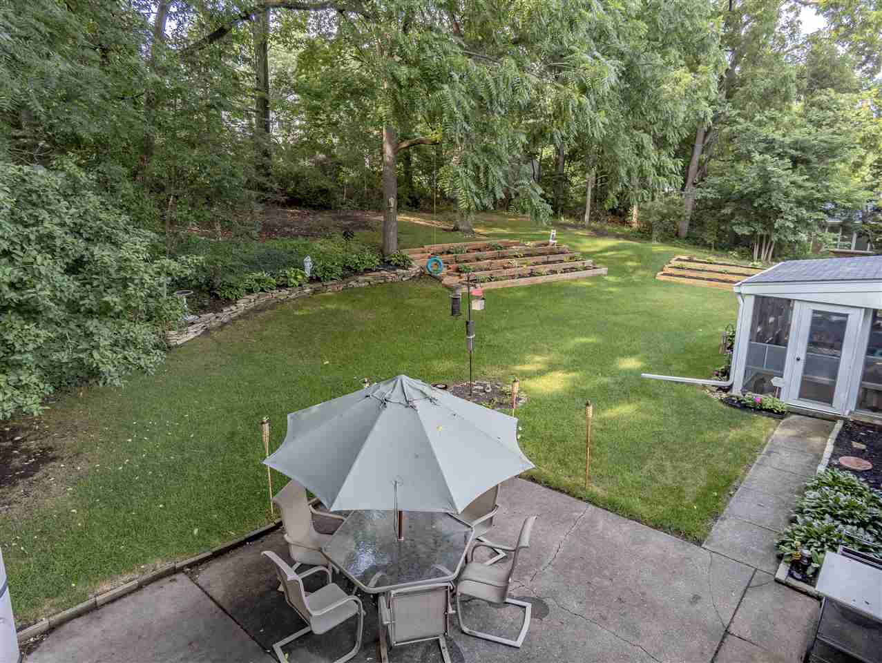 3208 Spring Creek Road Rockford, IL 61107 - Photo 34 of 45 a view of a chair and table on the green field