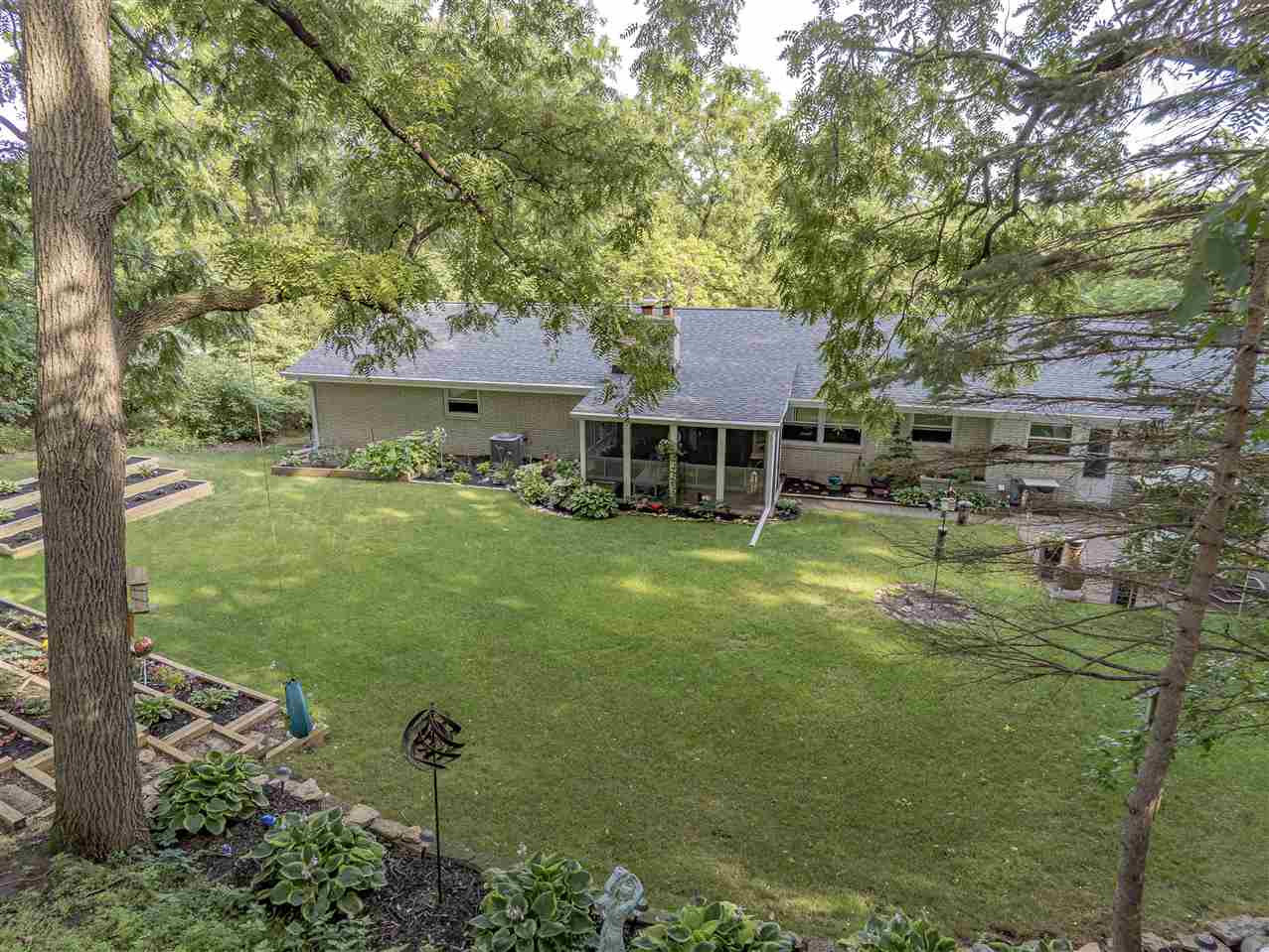 3208 Spring Creek Road Rockford, IL 61107 - Photo 39 of 45 a front view of a house with a yard