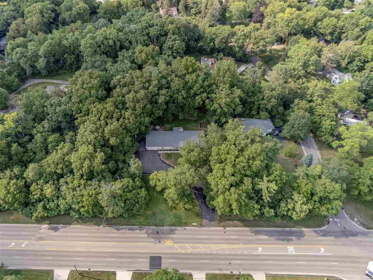 3208 Spring Creek Road Rockford, IL 61107 - Photo 43 of 45 an aerial view of a house with yard