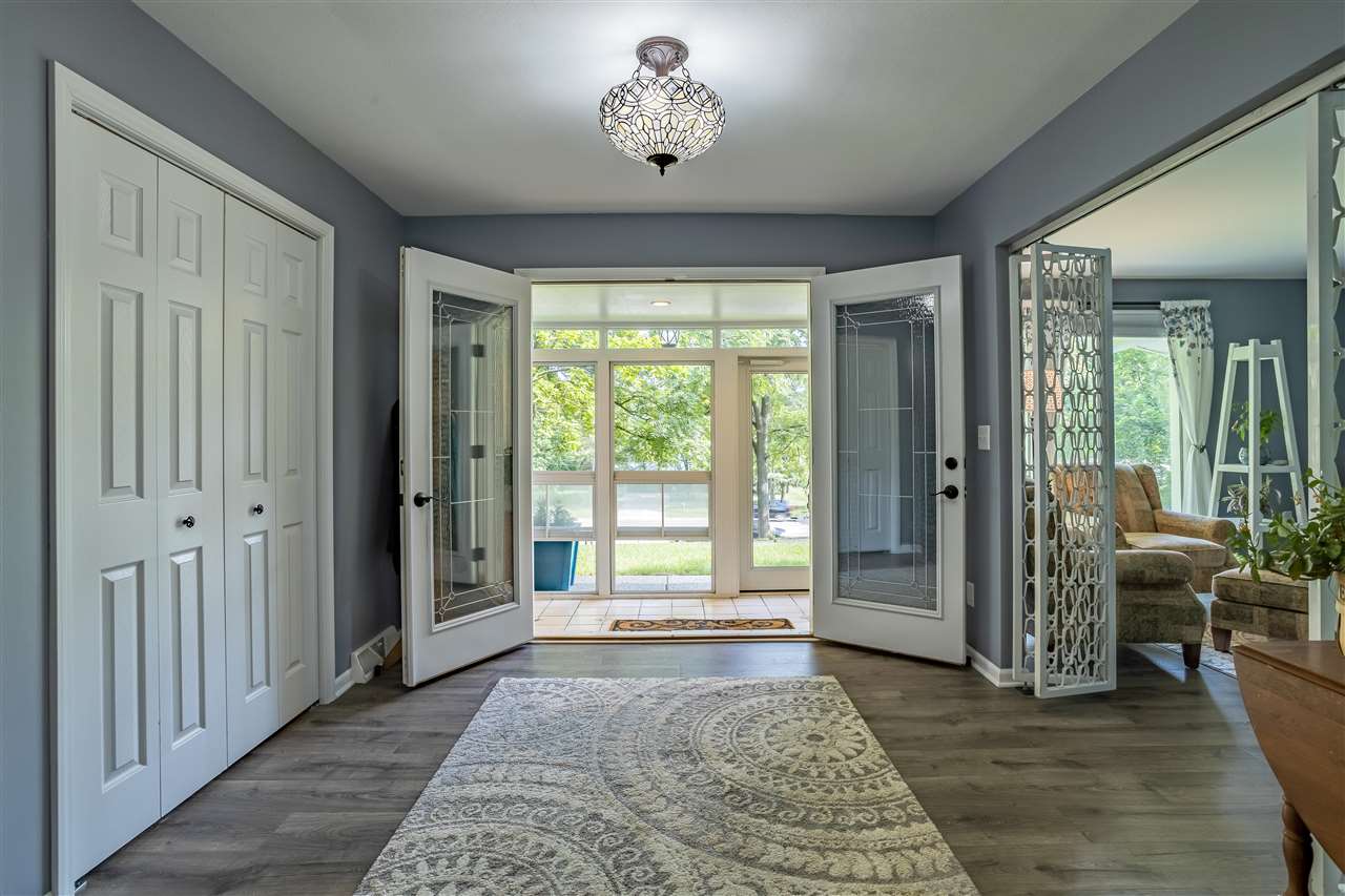 3208 Spring Creek Road Rockford, IL 61107 - Photo 7 of 45 wooden floor in an empty room with a window
