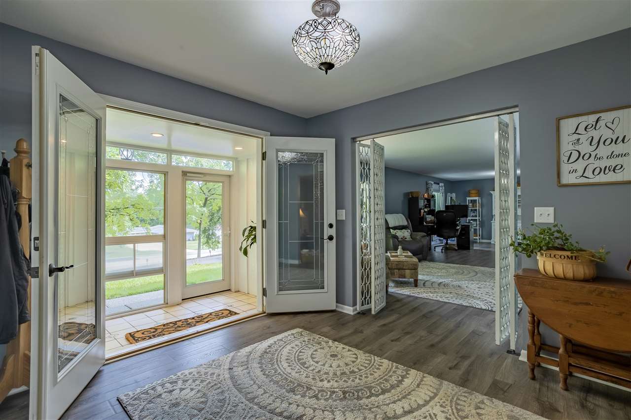 3208 Spring Creek Road Rockford, IL 61107 - Photo 8 of 45 a living room with furniture and a large window