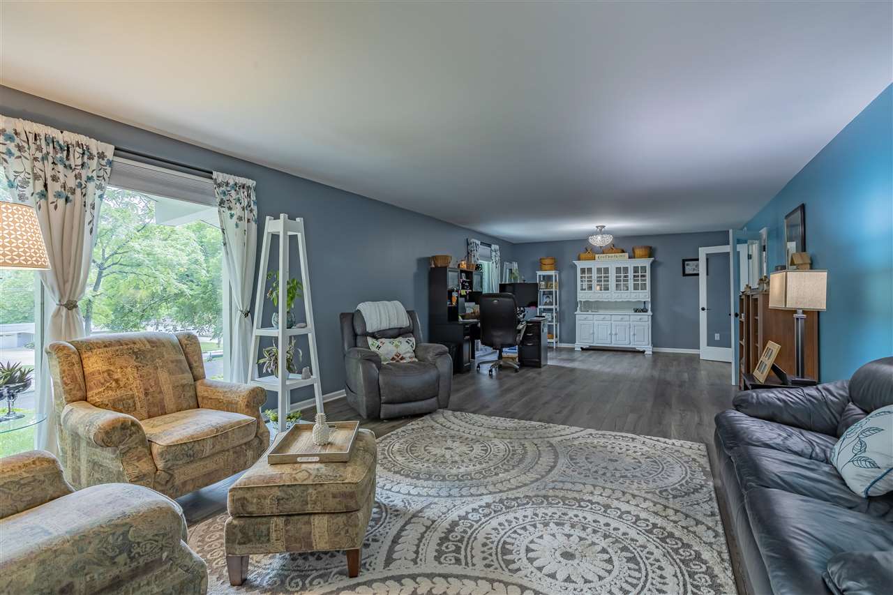 3208 Spring Creek Road Rockford, IL 61107 - Photo 9 of 45 a living room with furniture and a large window