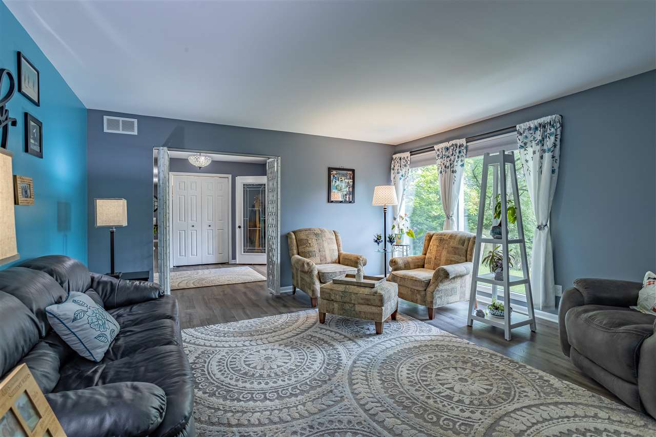 3208 Spring Creek Road Rockford, IL 61107 - Photo 10 of 45 a living room with furniture and a large window