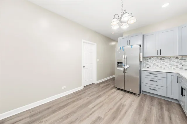 a bathroom with a sink a mirror and a shower