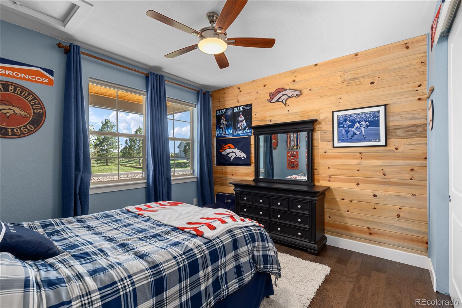 5181 Appleton Way Castle Rock, CO 80104 - Photo 23 of 44 a bedroom with a bed dresser and a window