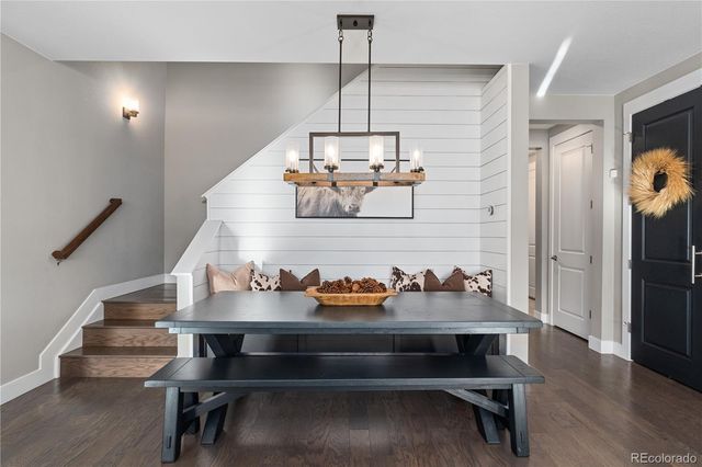 a view of entryway dining room and wooden floor