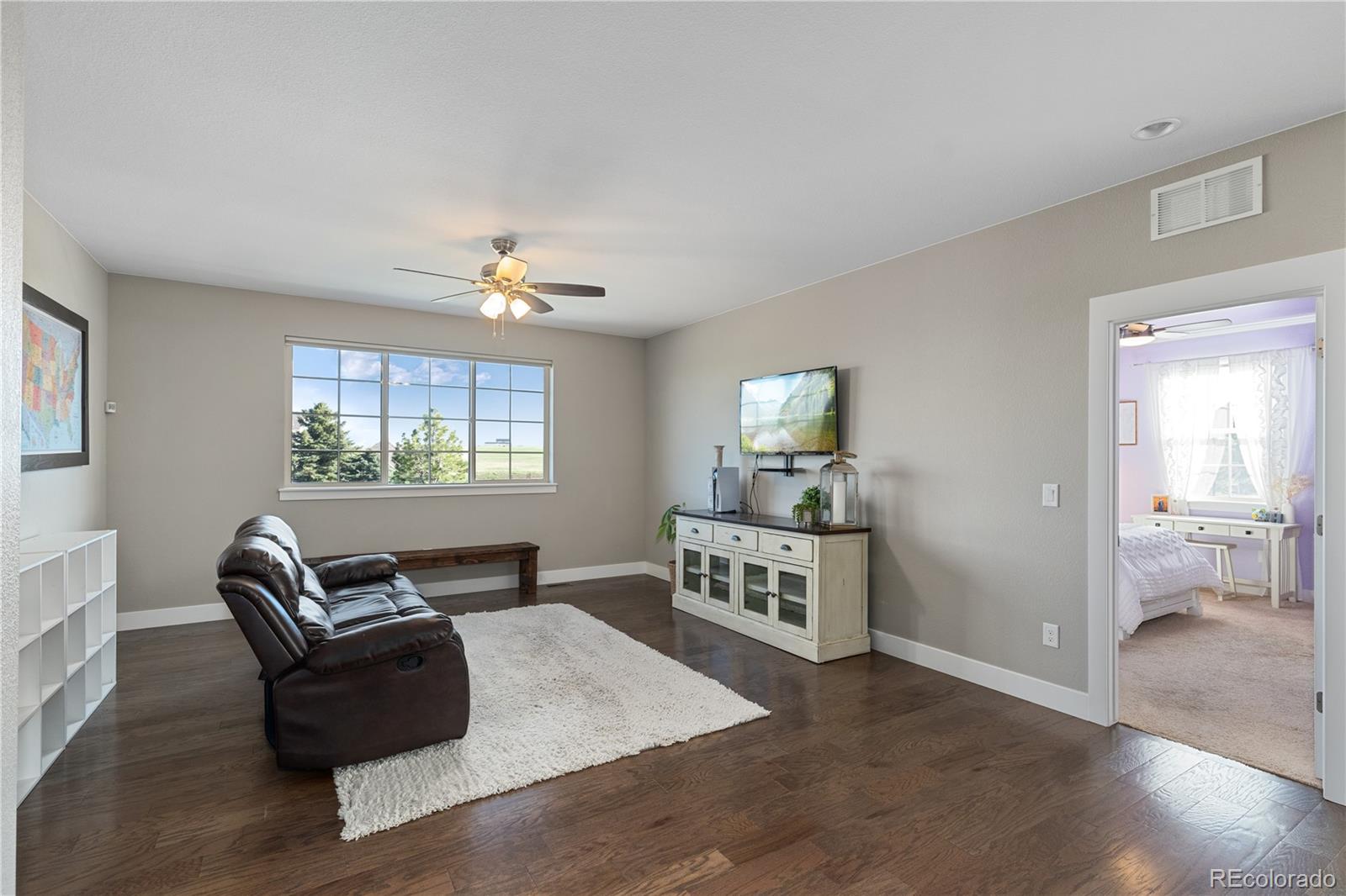 5181 Appleton Way Castle Rock, CO 80104 - Photo 27 of 44 a living room with furniture and a window