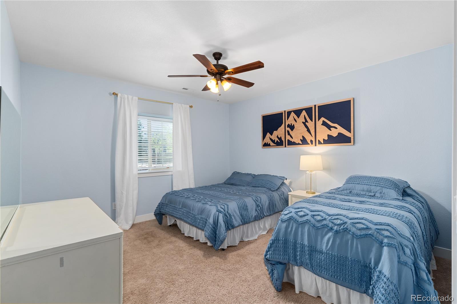 5181 Appleton Way Castle Rock, CO 80104 - Photo 33 of 44 a bedroom with two beds and painting on the wall
