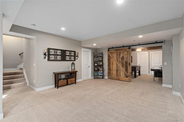an empty room with furniture and a window