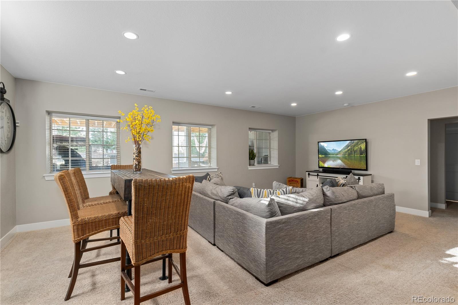 5181 Appleton Way Castle Rock, CO 80104 - Photo 37 of 44 a living room with furniture and a flat screen tv