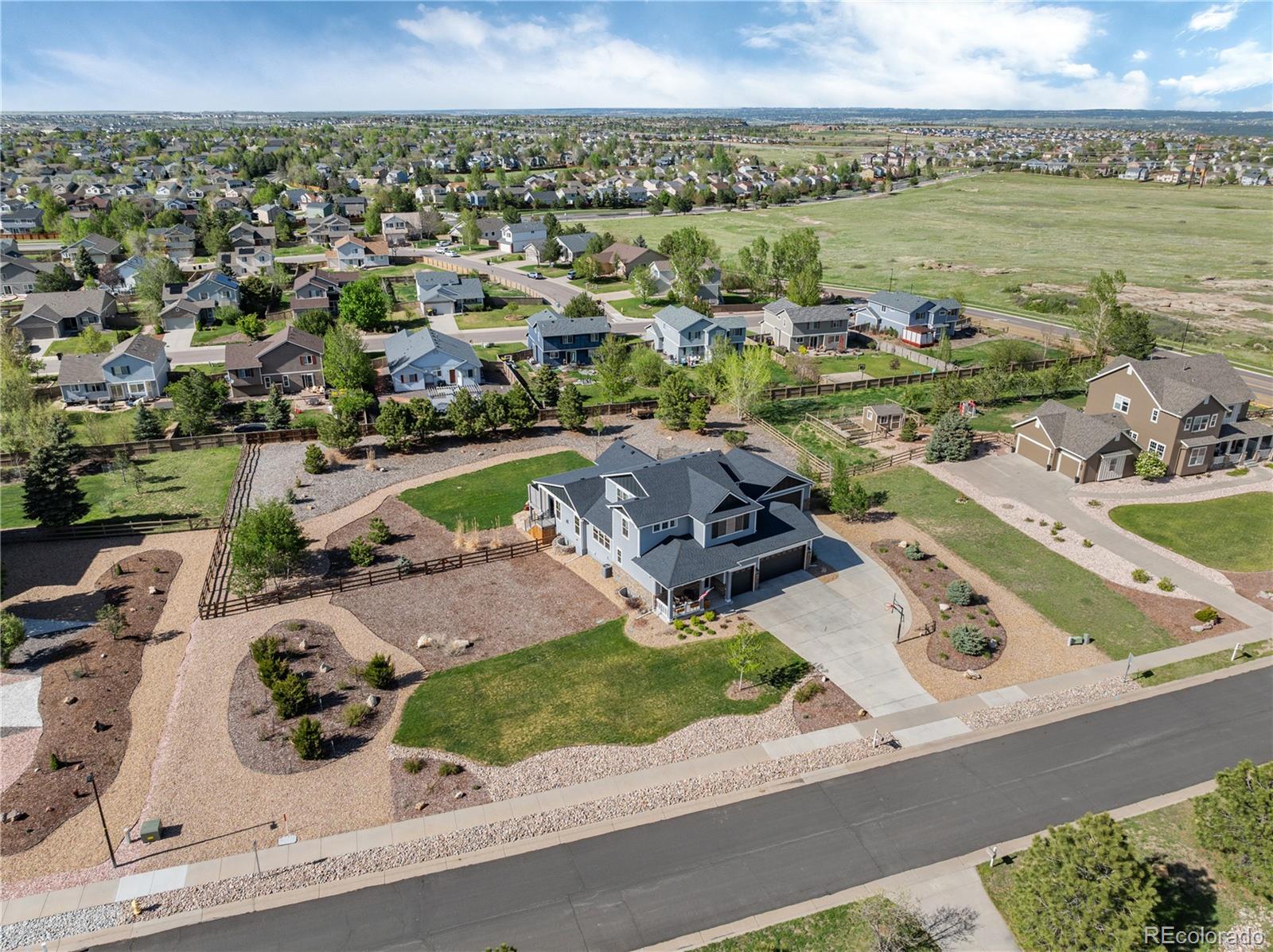 5181 Appleton Way Castle Rock, CO 80104 - Photo 7 of 44 an aerial view of a house with a swimming pool