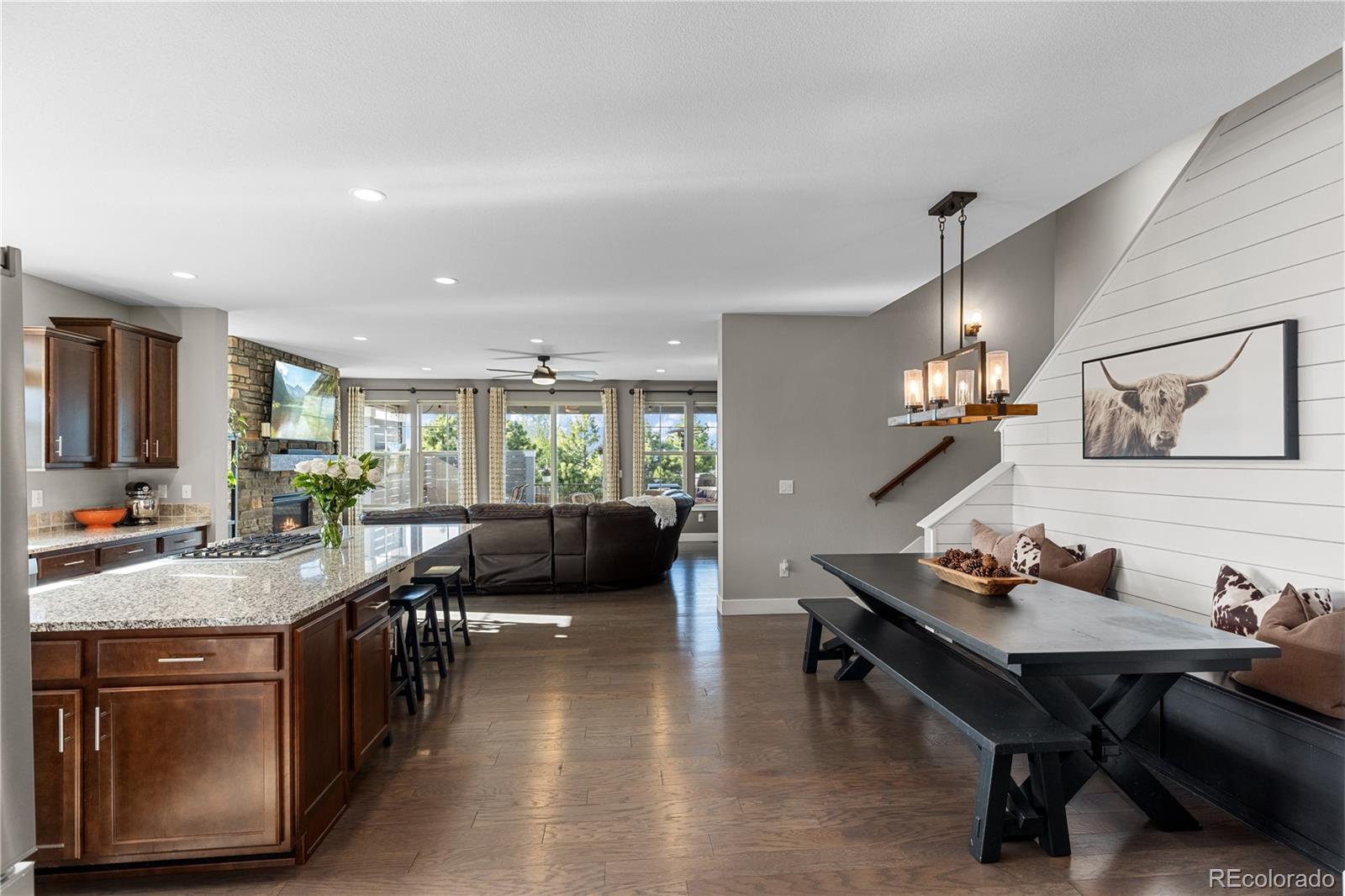 5181 Appleton Way Castle Rock, CO 80104 - Photo 10 of 44 a living room with stainless steel appliances furniture a rug and a kitchen view