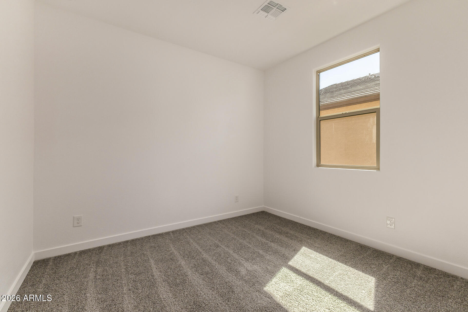 20618 West Thomas Road Buckeye, AZ 85396 - Photo 23 of 38 an empty room with a window