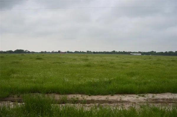 a view of a lake with a big yard