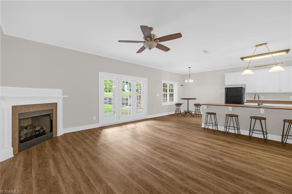 9127 County Line Road Kernersville, NC 27284 - Photo 23 of 49 Den In Basement View Of Exterior Patio Exit, Kitchen Area & Breakfast/Dining