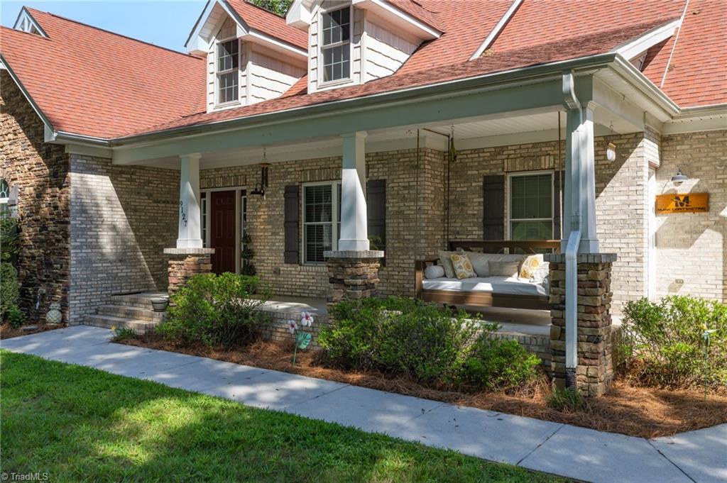 9127 County Line Road Kernersville, NC 27284 - Photo 3 of 49 Front porch with xl swing