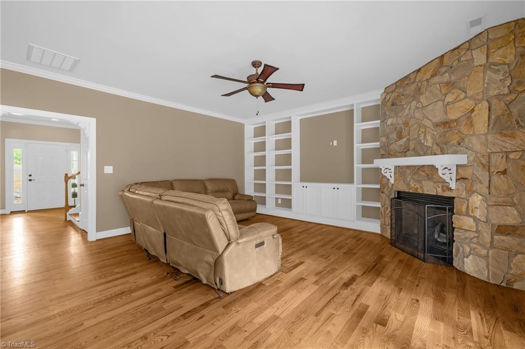 9127 County Line Road Kernersville, NC 27284 - Photo 10 of 49 Living Room Main Level w/Rock Fireplace & Built-In Shelving