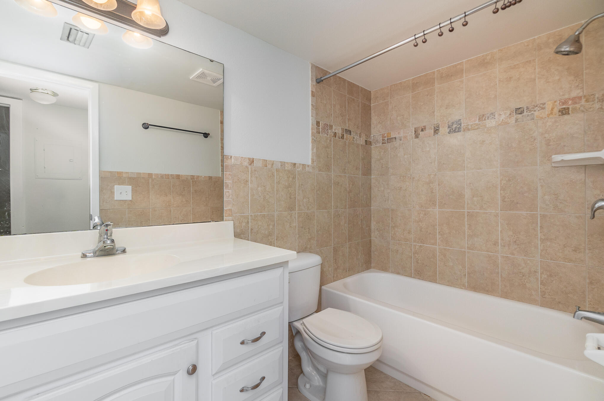 598 North Wickham Road, Unit 75 Melbourne, FL 32935 - Photo 16 of 21 a bathroom with a sink a toilet and shower