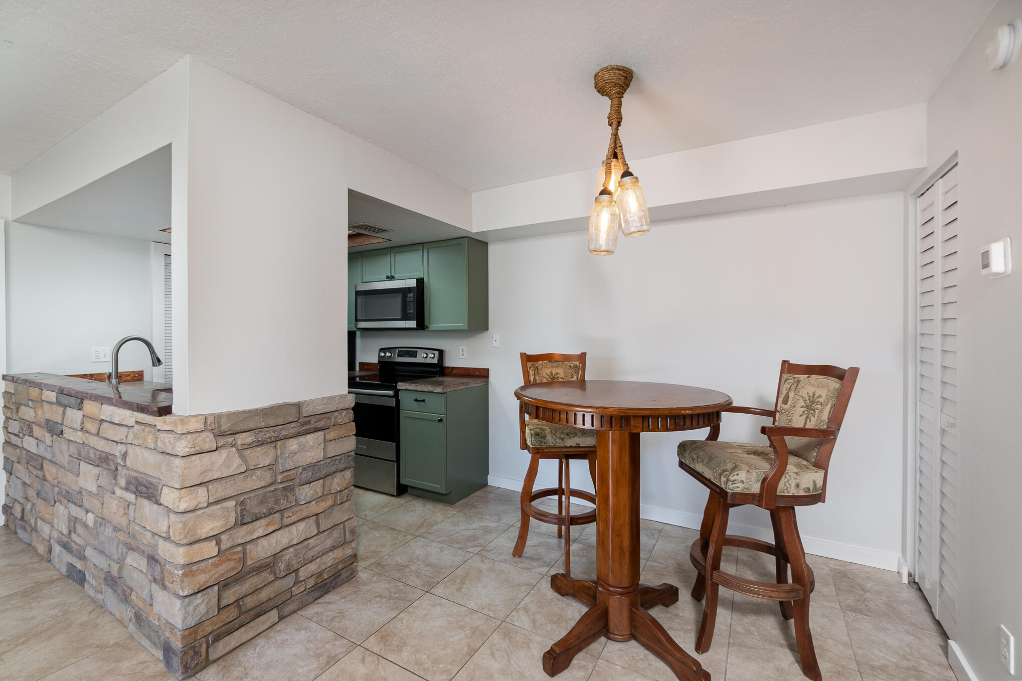 598 North Wickham Road, Unit 75 Melbourne, FL 32935 - Photo 6 of 21 a view of a workspace with furniture