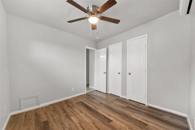 a view of a room with a ceiling fan