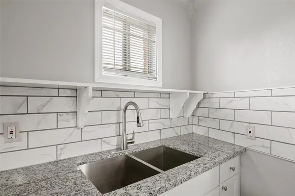 a view of a sink and dishwasher