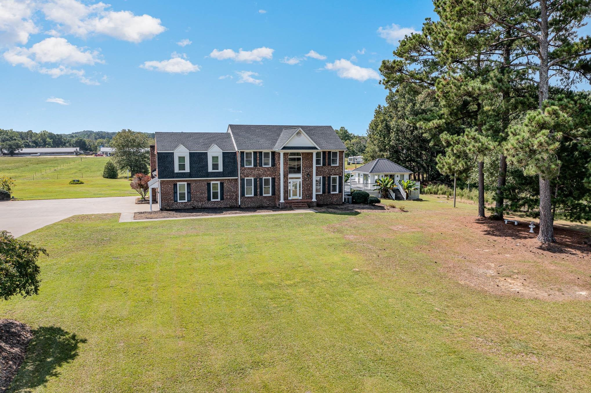 3591 Zacks Mill Road Angier, NC 27501 - Photo 1 of 44 a view of a house with a big yard and large trees