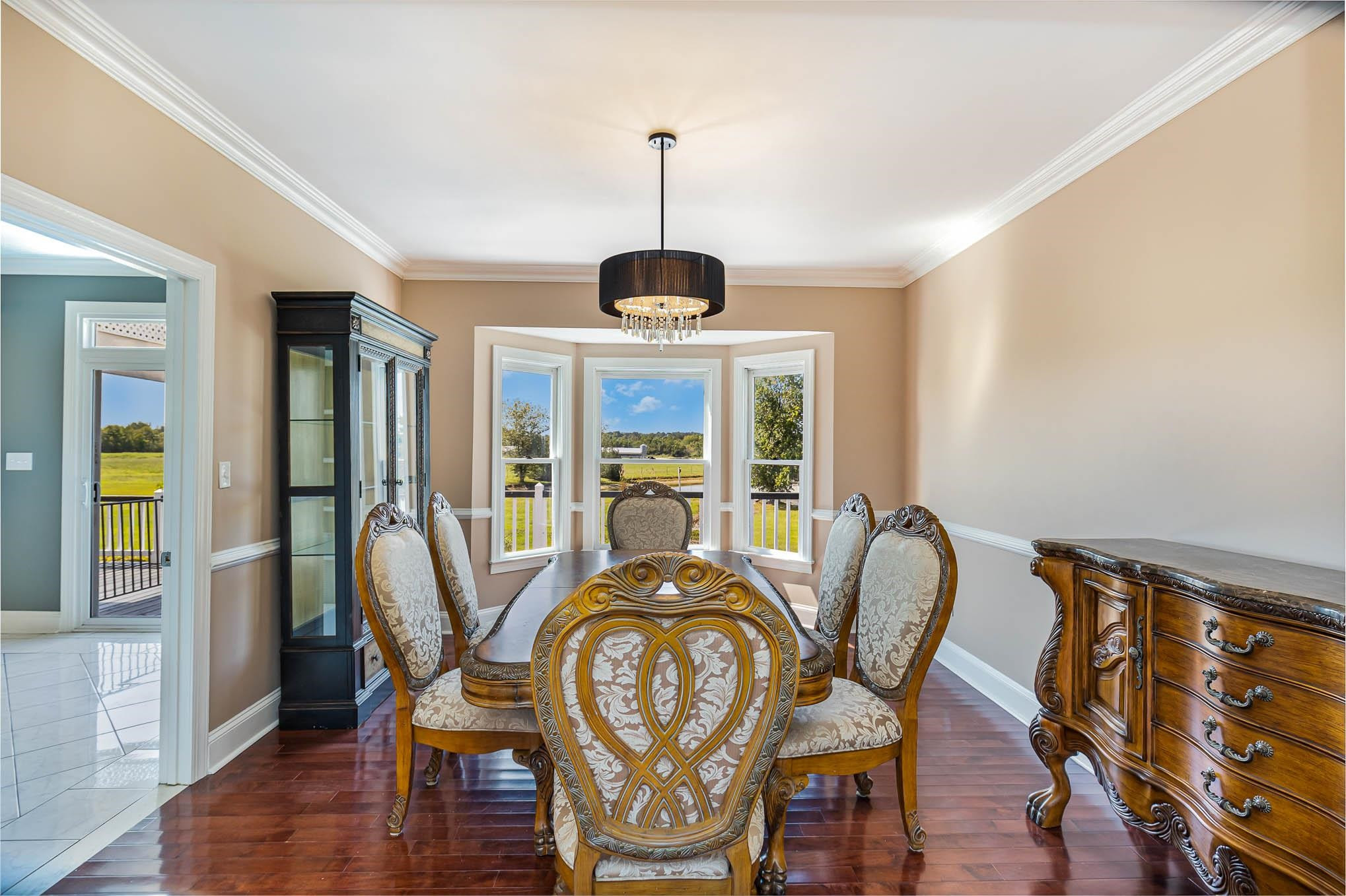 3591 Zacks Mill Road Angier, NC 27501 - Photo 12 of 44 a view of a dining room with furniture window and wooden floor