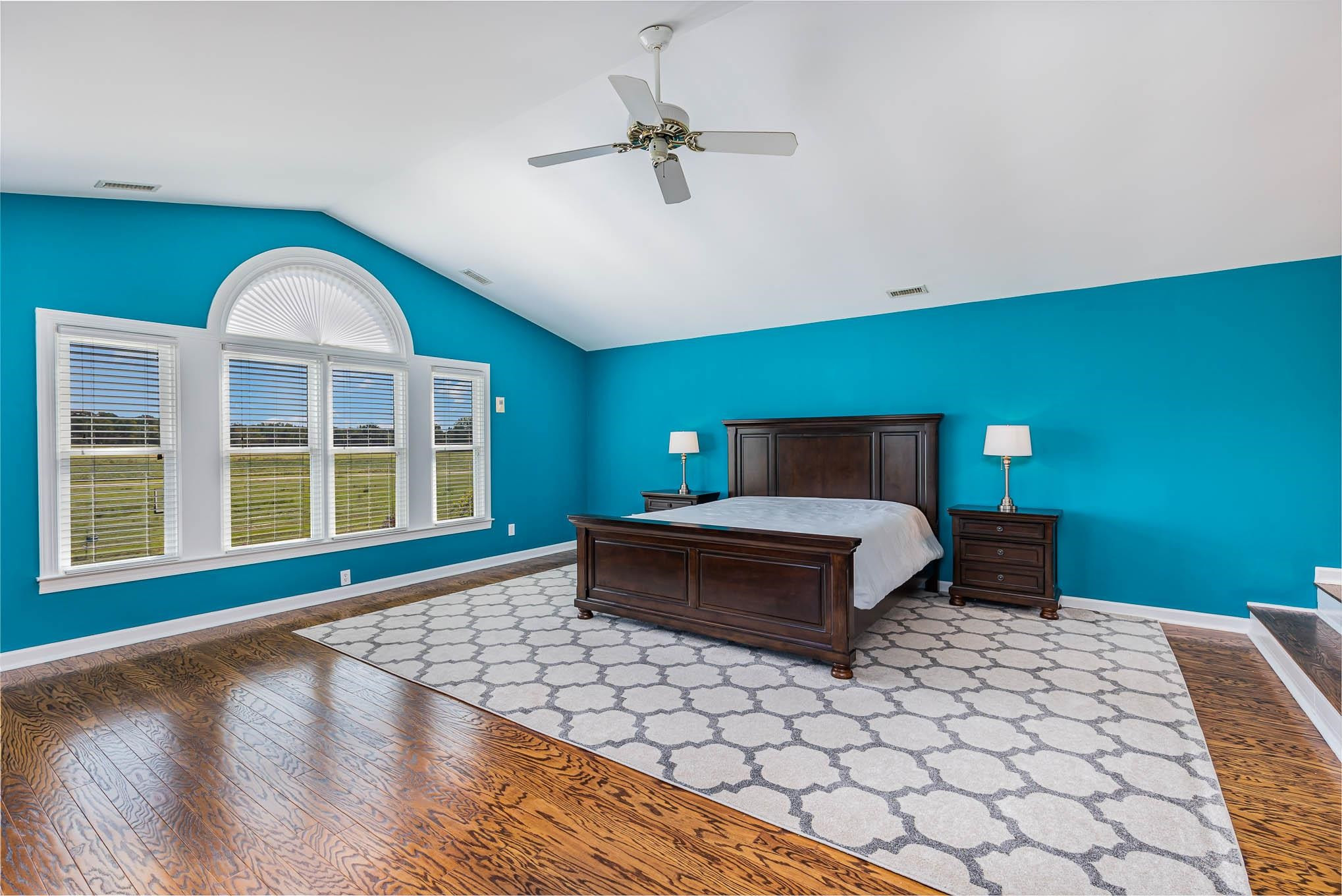 3591 Zacks Mill Road Angier, NC 27501 - Photo 17 of 44 a bedroom with a bed and a large window