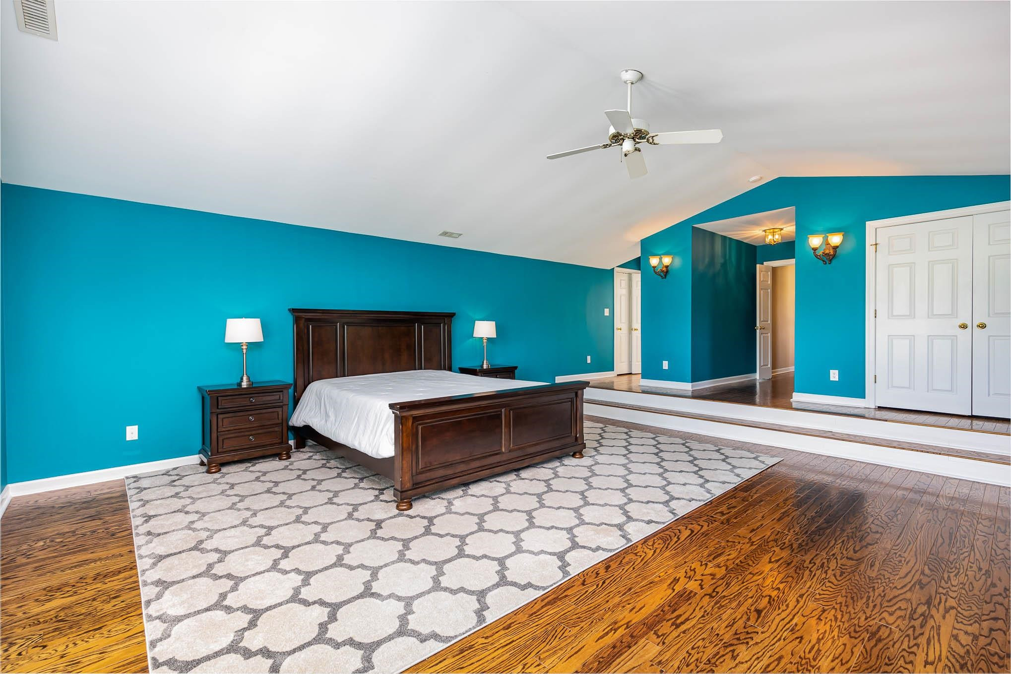3591 Zacks Mill Road Angier, NC 27501 - Photo 18 of 44 a bedroom with a bed and a night stand