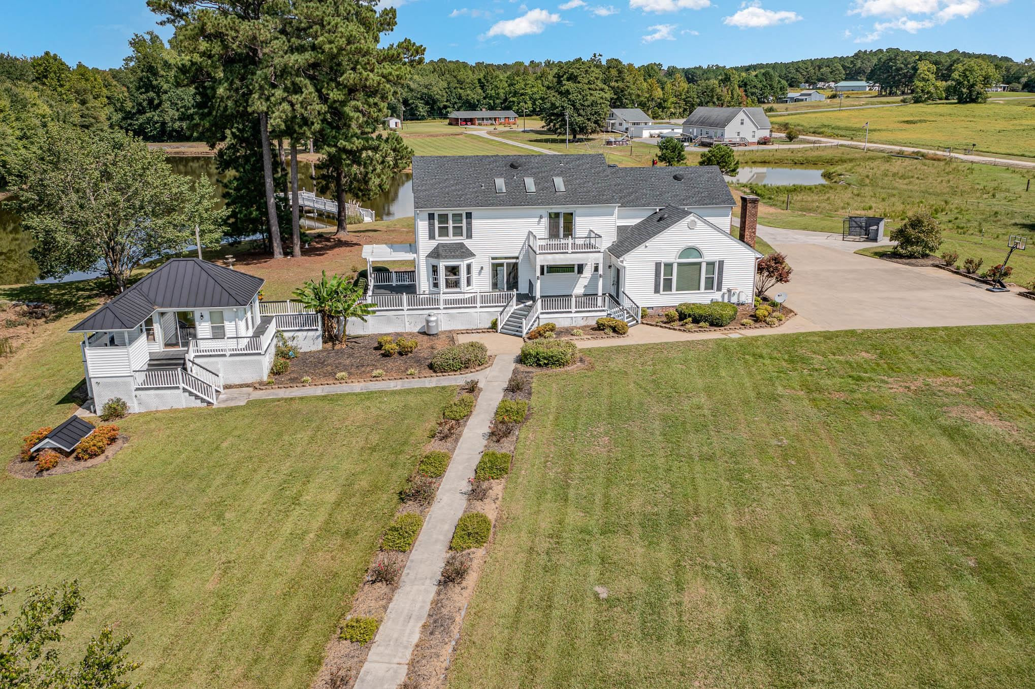 3591 Zacks Mill Road Angier, NC 27501 - Photo 2 of 44 a view of residential houses with outdoor space and river