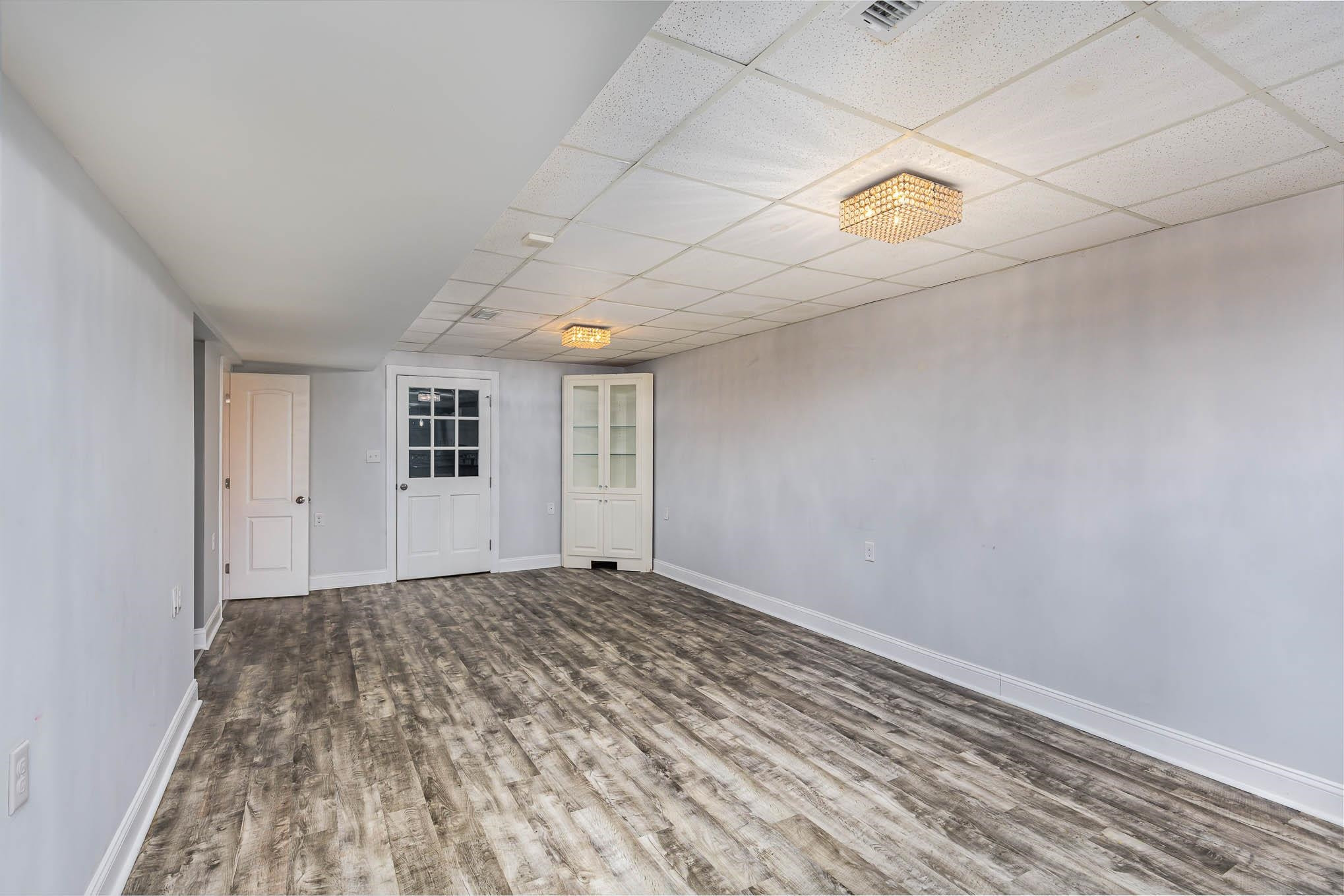3591 Zacks Mill Road Angier, NC 27501 - Photo 21 of 44 a view of an empty room with a window
