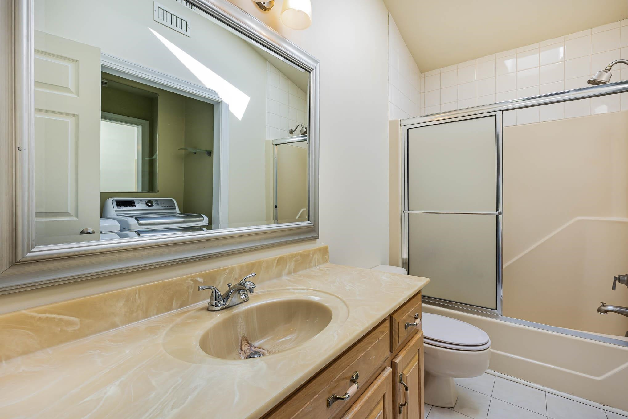 3591 Zacks Mill Road Angier, NC 27501 - Photo 28 of 44 a bathroom with a sink and a mirror