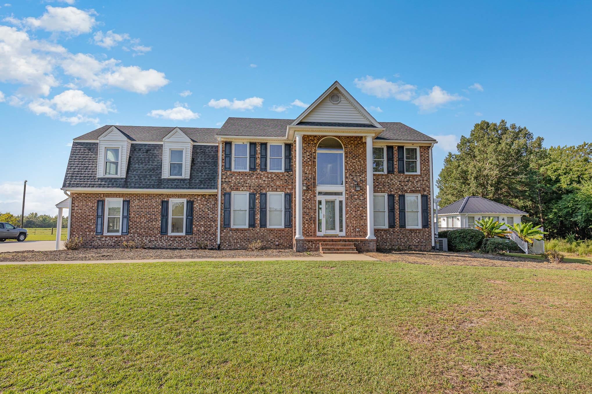 3591 Zacks Mill Road Angier, NC 27501 - Photo 3 of 44 a front view of a house with a yard