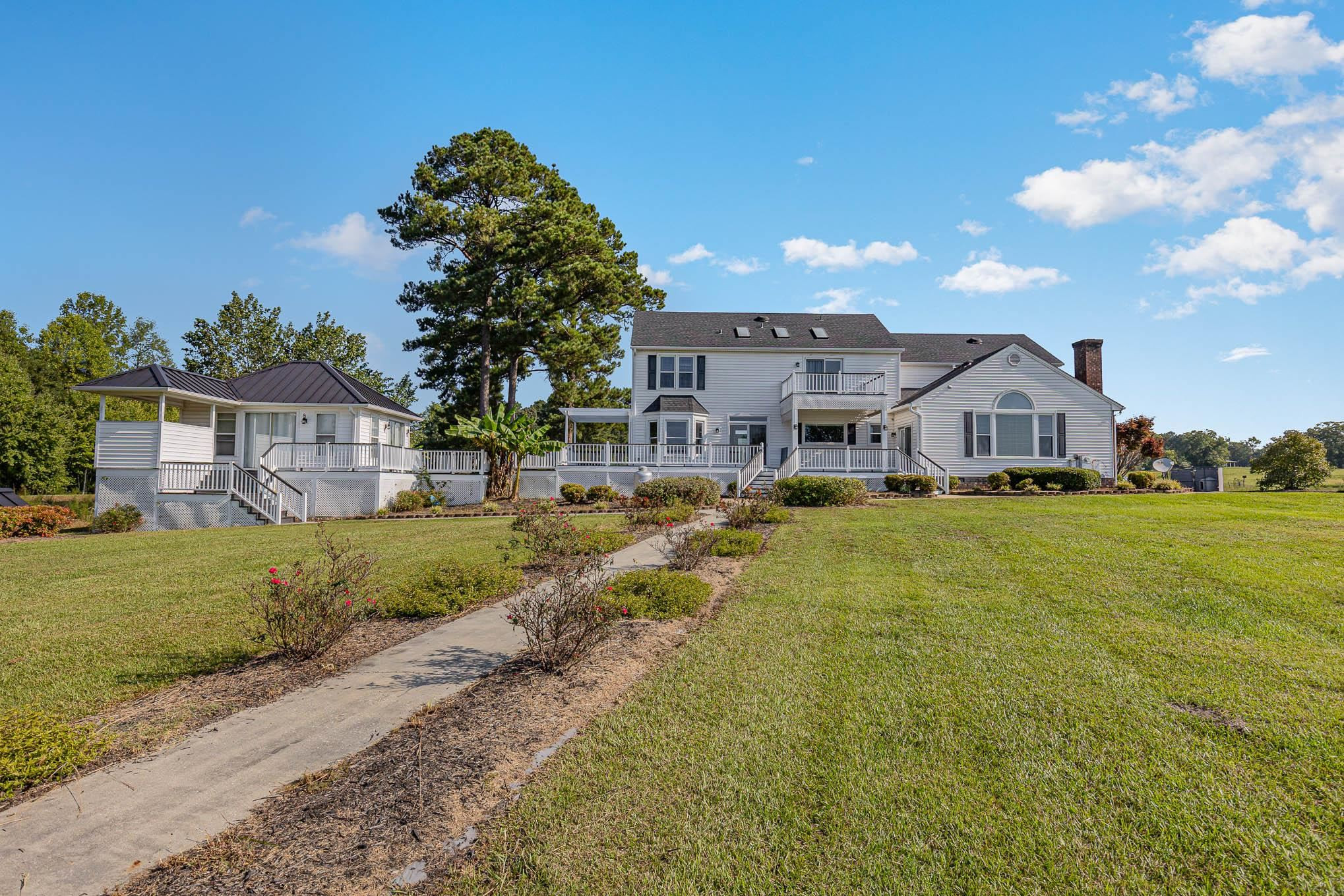 3591 Zacks Mill Road Angier, NC 27501 - Photo 35 of 44 a front view of a house with garden