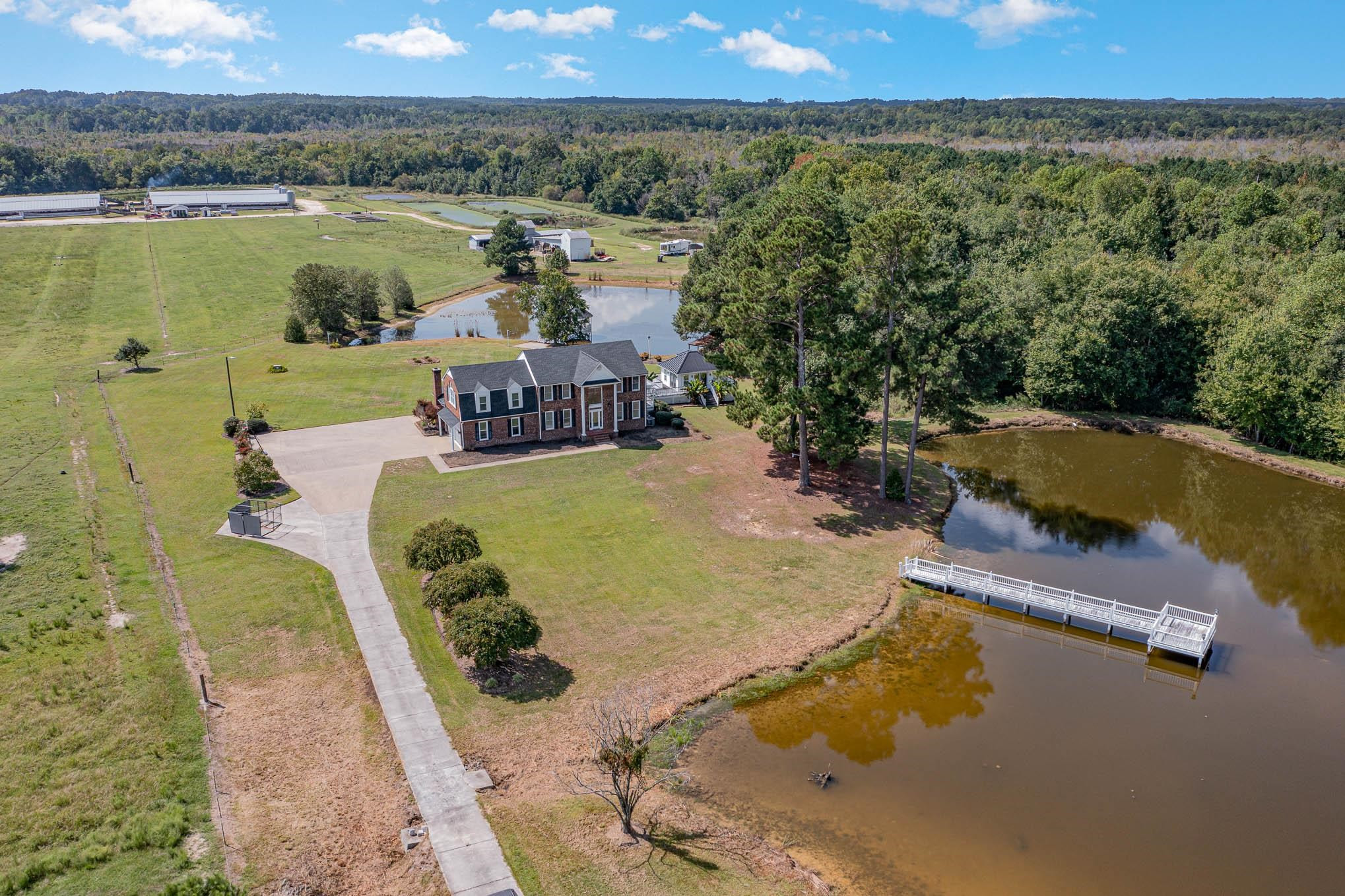 3591 Zacks Mill Road Angier, NC 27501 - Photo 37 of 44 an aerial view of a house with outdoor space
