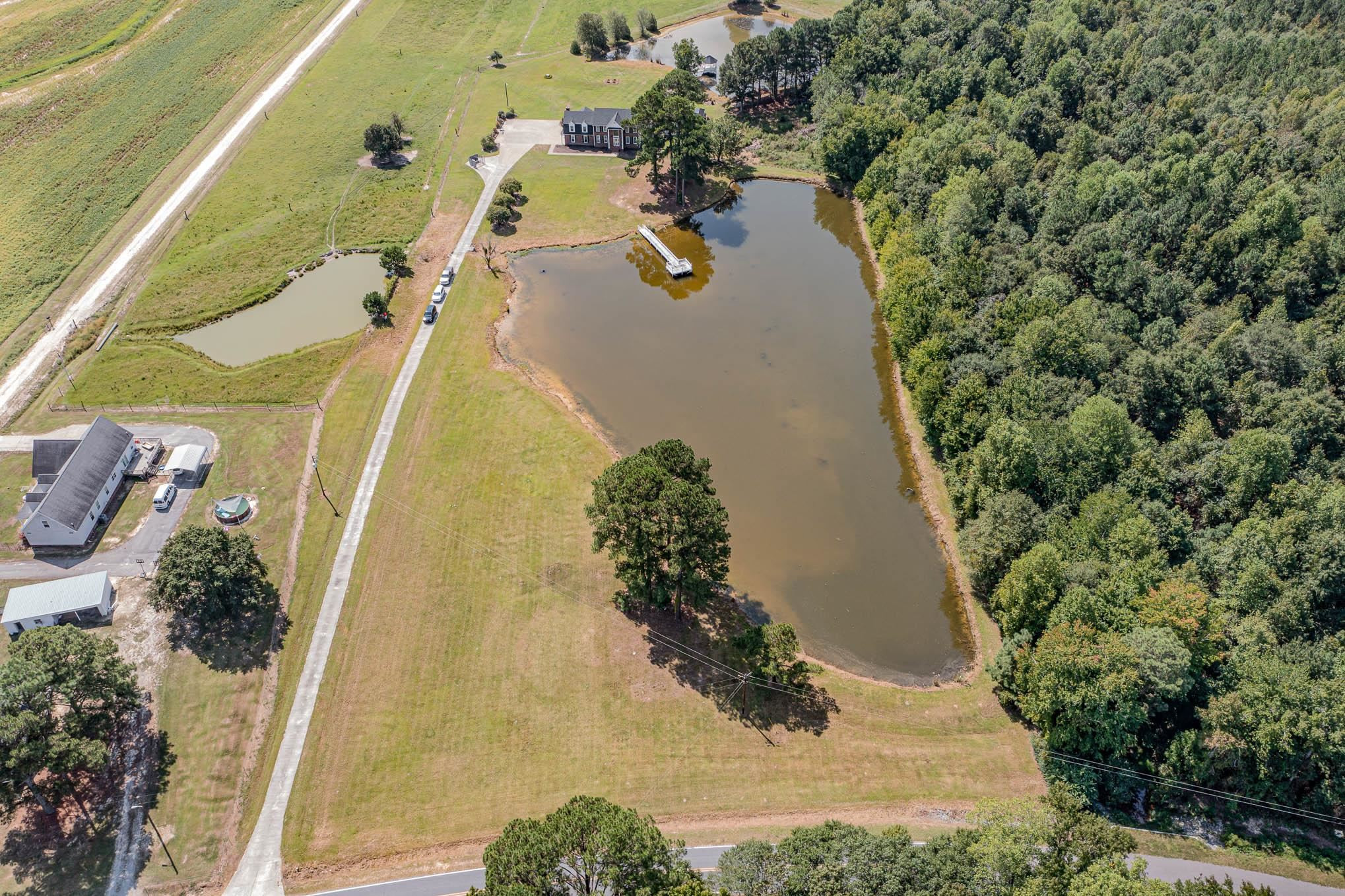3591 Zacks Mill Road Angier, NC 27501 - Photo 39 of 44 an aerial view of residential house with outdoor space and swimming pool