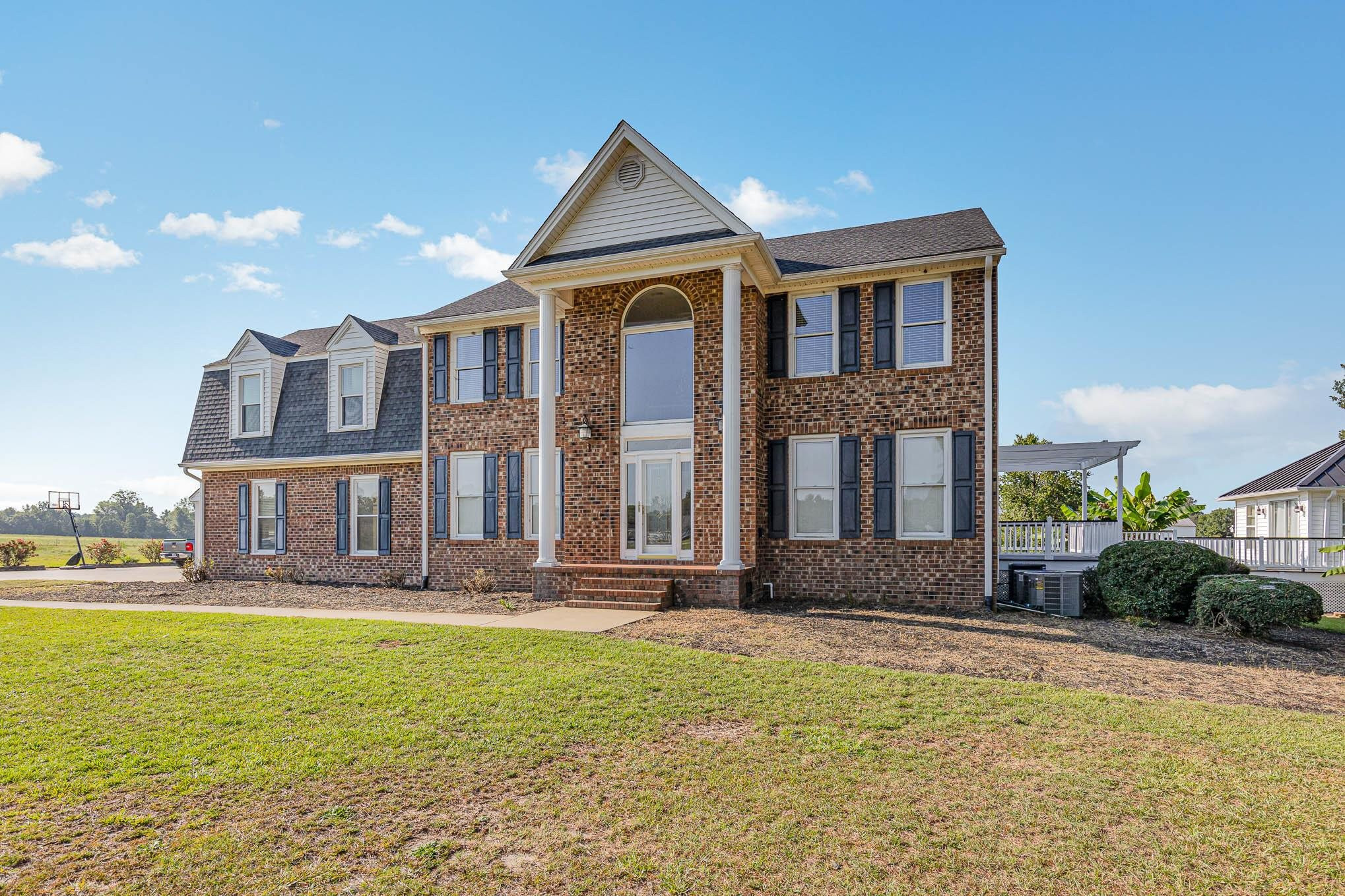 3591 Zacks Mill Road Angier, NC 27501 - Photo 4 of 44 a front view of a house with a yard