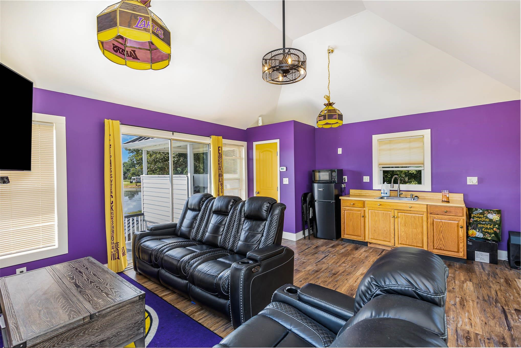 3591 Zacks Mill Road Angier, NC 27501 - Photo 42 of 44 a living room with furniture and a flat screen tv