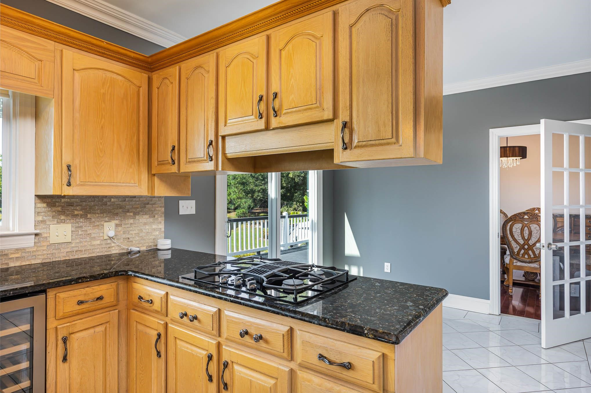 3591 Zacks Mill Road Angier, NC 27501 - Photo 7 of 44 a kitchen with a stove a sink and a window
