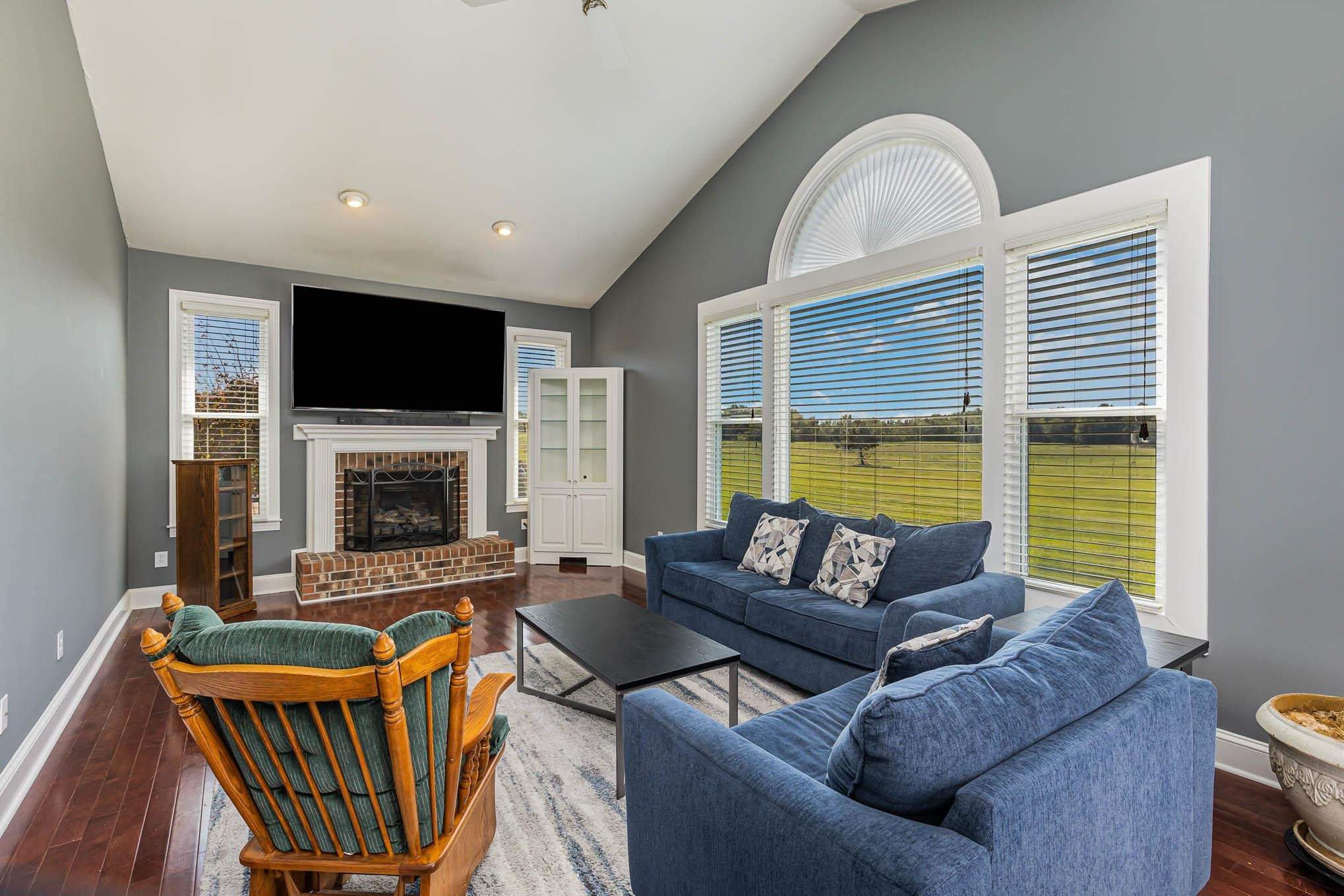 3591 Zacks Mill Road Angier, NC 27501 - Photo 10 of 44 a living room with fireplace furniture and a flat screen tv